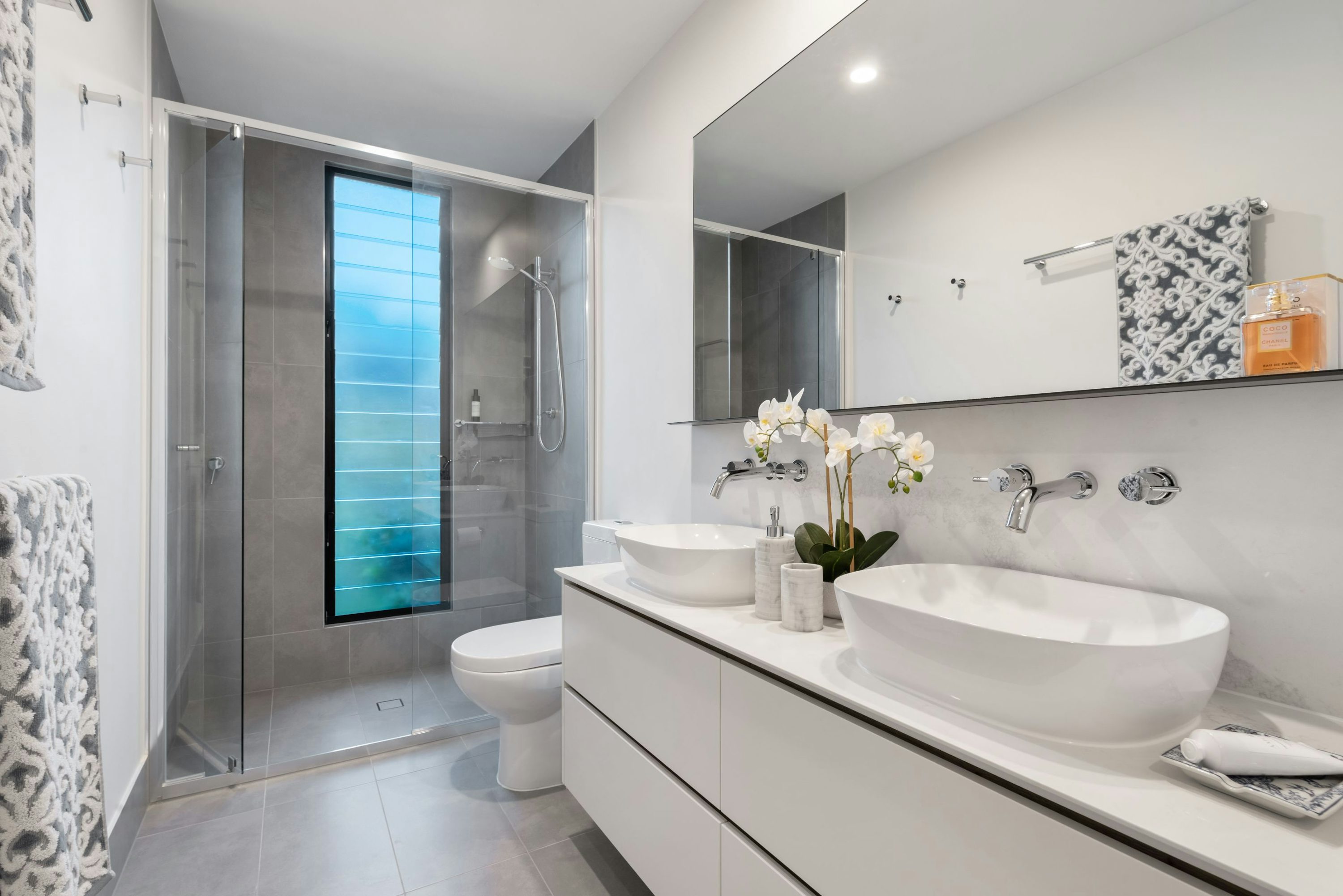 Professional porcelain tile bathroom with tiled shower and floor